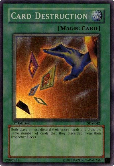 A "Yu-Gi-Oh!" trading card titled "Card Destruction [SDY-042] Super Rare" from the Starter Deck: Yugi. This Super Rare card has a green border indicating it's a Normal Spell. The image depicts a hand scattering various cards. The effect text states: "Both players must discard their entire hands and draw the same number of cards that they discarded.