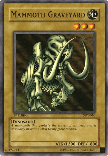 Image of a "Mammoth Graveyard [SDY-010] Common" Yu-Gi-Oh! trading card from the Starter Deck: Yugi. This common Normal Monster features an ancient, skeletal mammoth illustration with tusks and a menacing appearance. The text box reads, "A mammoth that protects the graves of its pack and is absolutely merciless when facing grave-robbers." Stats: ATK/