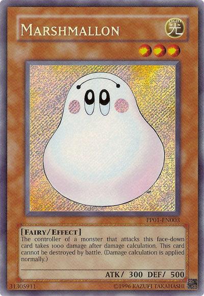 A "Marshmallon [PP01-EN003] Secret Rare" Yu-Gi-Oh! card with an image of a smiling, cartoonish, white blob character with large eyes and blush marks. The Secret Rare card from Premium Pack 1 features a light background with holographic effects. Boasting 300 ATK and 500 DEF, it’s identified as a Fairy/Effect monster with detailed effect text.