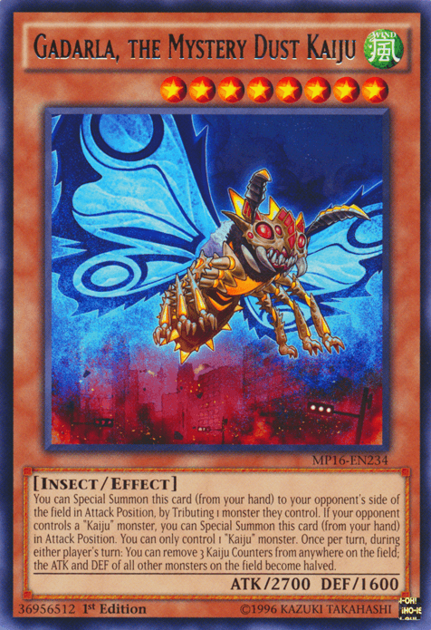 A Yu-Gi-Oh! trading card, Gadarla, the Mystery Dust Kaiju [MP16-EN234], is a rare card from the Mega-Tins Mega Pack. This Kaiju monster depicts an insect-like creature with large luminescent blue wings and a mechanical body, set against a cityscape shrouded in red mist. It boasts stats of ATK/2700 and DEF/1600.