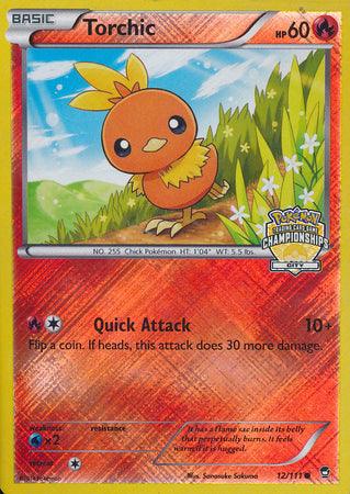 An image of a Pokémon trading card featuring Torchic. Torchic, a small orange chick with yellow feathers on its head, is depicted standing on grass with a blue sky background. The card details include 60 HP, the move "Quick Attack," and a description of Torchic. The Championship promo card is **Torchic (12/111) (City Championship Promo) [XY: Furious Fists] by Pokémon**.
