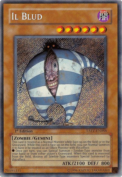 The "Yu-Gi-Oh!" card named "Il Blud [TAEV-EN088] Secret Rare" boasts a dark attribute and showcases a Zombie-Type Gemini Monster. This creature is depicted as a zombie with a large, round body, one eye, and blue striped clothing. Its stats include an ATK of 2100 and a DEF of 800, with card text describing its distinctive effects and abilities.