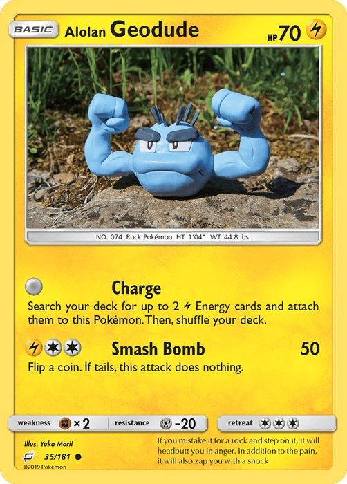 A Pokémon trading card from the Sun & Moon series featuring Alolan Geodude (35/181) [Sun & Moon: Team Up]. The card, part of the Team Up set, has a yellow border, 70 HP, and showcases an illustration of a gray, rock-like creature with muscular arms and an angry expression. The moves listed are "Charge" and "Smash Bomb," with the card number 35/181 below the image.