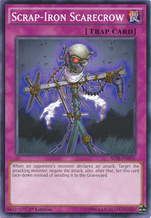 The image is of a Yu-Gi-Oh! trading card titled "Scrap-Iron Scarecrow [SDSE-EN035] Common" from the Synchron Extreme Structure Deck. It is a Normal Trap Card with a purple border. The artwork depicts a scarecrow made of scrap metal parts with glowing red eyes, nailed onto a wooden cross. The effect of the card is described in the text box below.
