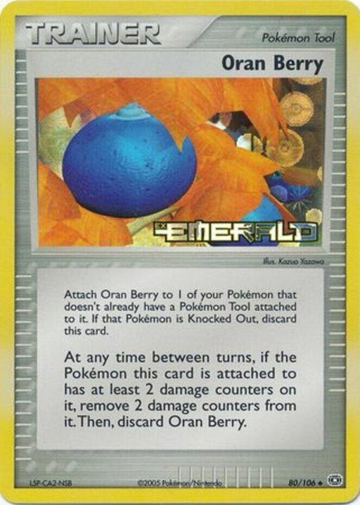 The image showcases an "Oran Berry (80/106) (Stamped) [EX: Emerald]" Pokémon trading card from the Trainer category. This uncommon card from the EX Emerald series features a silver background with a blue berry encircled by orange leaves. The text details its use as an item, highlighting its ability to attach to a Pokémon and potentially heal damage.