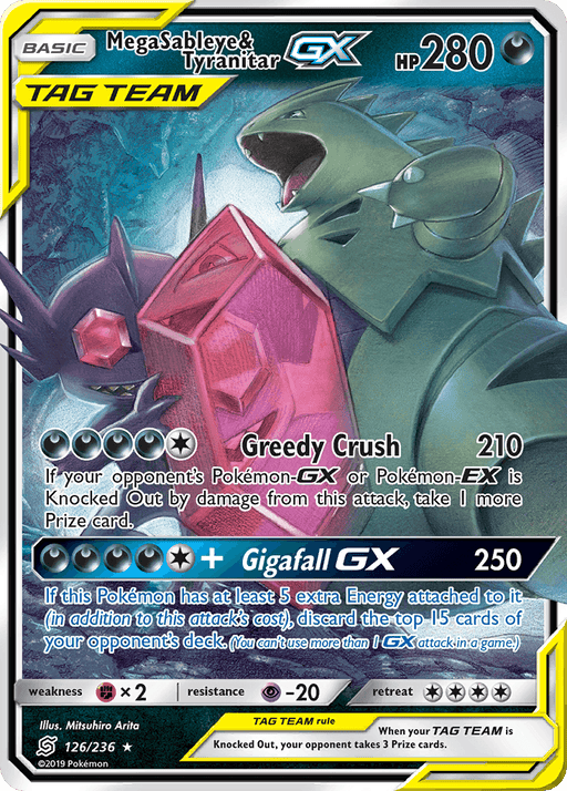 This image features an Ultra Rare Pokémon card for Mega Sableye & Tyranitar GX (126/236) [Sun & Moon: Unified Minds] from the Pokémon series. The card showcases Mega Sableye clinging to a large, red gemstone while Tyranitar roars. The holographic card highlights various stats and abilities, including "Greedy Crush" and "Gigafall GX.