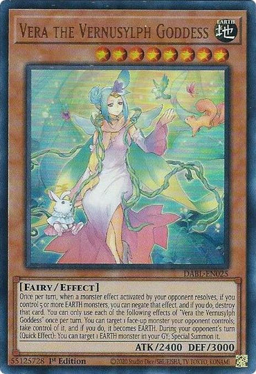 A Yu-Gi-Oh! card named "Vera the Vernusylph Goddess [DABL-EN025] Ultra Rare" features a fairy-like character with flowing blue and green hair, wearing an elegant dress. She is surrounded by glowing orbs. The Ultra Rare Effect Monster boasts stats of ATK 2400 and DEF 3000, with a detailed description of its effects.