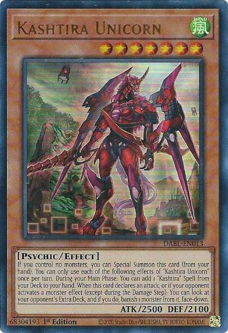 The image showcases a Yu-Gi-Oh! trading card named "Kashtira Unicorn [DABL-EN013] Ultra Rare" from the Darkwing Blast set. The card has a green border indicating its WIND attribute and features a futuristic, armored unicorn amid a swirling purple energy backdrop. It is a Level 7 Psychic/Effect monster with 2500 ATK and 2100 DEF.