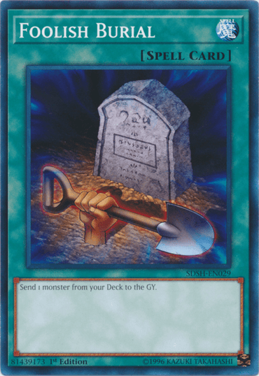 A Yu-Gi-Oh! trading card titled "Foolish Burial [SDSH-EN029] Common." This Normal Spell card features a graveyard scene with a gravestone inscribed with ancient symbols. In front of the gravestone is a hand gripping a shovel thrusting out of the ground. The text on the card reads, "Send 1 monster from your Deck to the GY.