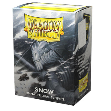 The image features a box of Arcane Tinmen's Dragon Shield: Standard 100ct Sleeves - Snow (Dual Matte), with 100 opaque sleeves and a black interior. The design includes a dragon in snow on white packaging with blue accents and the Dragon Shield logo.