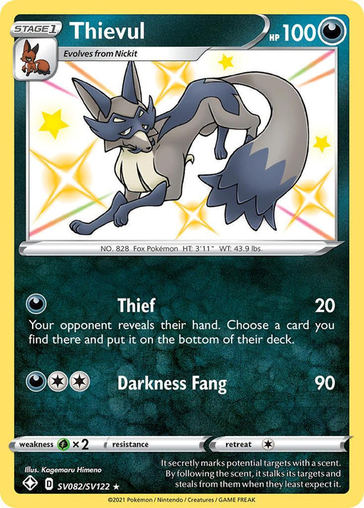 A Thievul (SV082/SV122) [Sword & Shield: Shining Fates] Pokémon card from the Pokémon series. This Ultra Rare card, also part of the Shining Fates set, features a dark blue and cream-colored fox-like Pokémon with a bushy tail and eye-mask markings, depicted mid-stride. It has 100 HP and the moves "Thief" and "Darkness Fang." It's number 828 in the Pokédex.