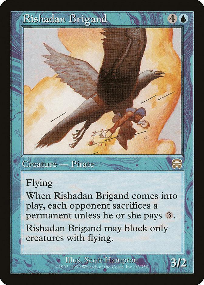 The Magic: The Gathering card "Rishadan Brigand [Mercadian Masques]" features a Human Pirate riding a large bird, soaring through the sky. This blue-bordered card has a mana cost of 4U, belongs to the Pirate creature type, and possesses abilities such as Flying and forcing an opponent to sacrifice a permanent. The card's power and toughness are 3/2.