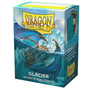 A colorful box of Arcane Tinmen Dragon Shield: Standard 100ct Sleeves - Glacier (Dual Matte) labeled "Glacier." The front illustration depicts a dragon emerging from icy waters with icebergs in the background. The packaging, made of sturdy cardboard, indicates it contains 100 sleeves with a black interior and the Dragon Shield logo prominently displayed at the top.