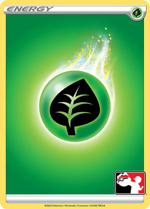 A **Grass Energy [Prize Pack Series One]** card featuring a green background with a green orb in the center, depicting a black leaf symbol, representing Grass Energy. With common rarity from Prize Pack Series One, the top-left corner has the word "Energy," while the bottom-right corner displays the Pokémon TCG logo with a silhouette of a person throwing a Poké Ball.
