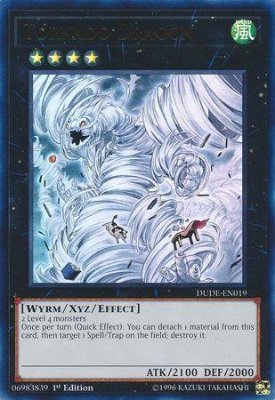 Image of a Yu-Gi-Oh! trading card titled "Tornado Dragon [DUDE-EN019] Ultra Rare." The Xyz/Effect Monster depicts a dragon emerging from a swirling tornado in a stormy sky. Requiring 2 Level 4 monsters, its stats are ATK 2100 and DEF 2000, and its effect involves detaching material to destroy a Spell/Trap.