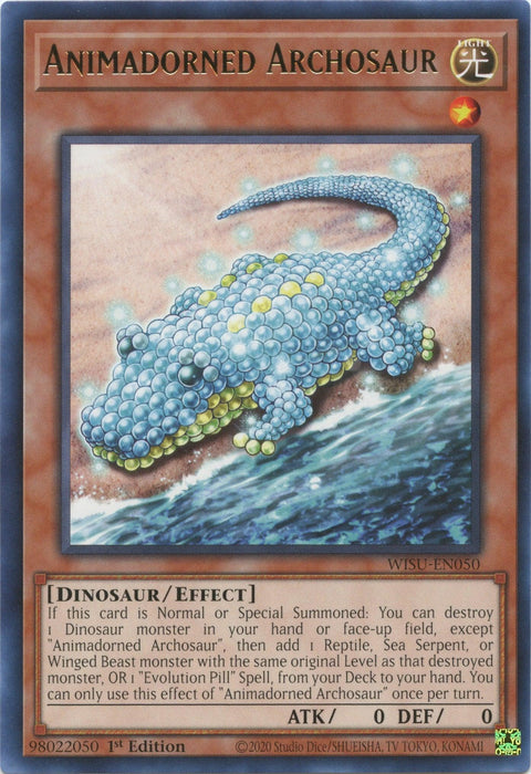 A trading card named "Animadorned Archosaur [WISU-EN050] Rare" from the Yu-Gi-Oh! Wild Survivors series. It features a dinosaur-like creature made of translucent orbs, with light reflections and small details. The mostly blue creature has some white areas. Detailed text about its effects and Evolution Pill attributes fills the description box.