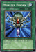 An image of the "Monster Reborn [SKE-029] Common" Yu-Gi-Oh! trading card from "Starter Deck: Kaiba Evolution." The card is green, designated as a "Normal Spell Card." The artwork displays an ornate, silver ankh with a green gemstone at its top and red and blue gems along its body. The text box reads: "Select 1 monster from either you or your opponent