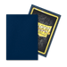 The image shows two Dragon Shield: Japanese Size 60ct Sleeves - Midnight Blue (Matte) by Arcane Tinmen. One sleeve is plain dark blue and is positioned in front of another sleeve that displays the back of a card featuring the "Dragon Shield" logo with a gold border, textured dark background, and yellow text. The card sleeves overlap slightly.