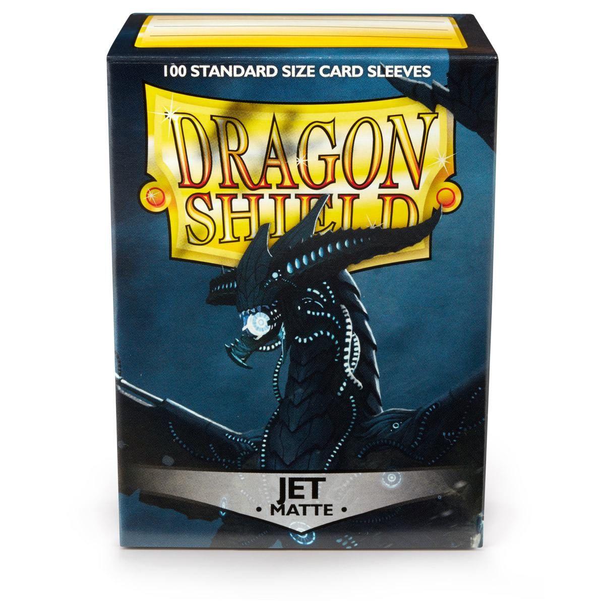 The image showcases a box of Arcane Tinmen's Dragon Shield: Standard 100ct Sleeves - Jet (Matte). The dark box features an illustration of a black dragon with blue accents. 