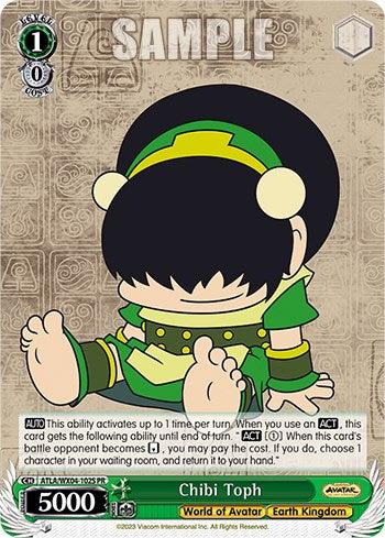 A promo card features "Chibi Toph (Foil) [Avatar: The Last Airbender]" from the series "Avatar: The Last Airbender." Toph is depicted in a cute, chibi style wearing her green Earth Kingdom attire. She sits cross-legged with eyes closed, holding a small, green fan. The card displays various stats, abilities, and game-related text by Bushiroad.