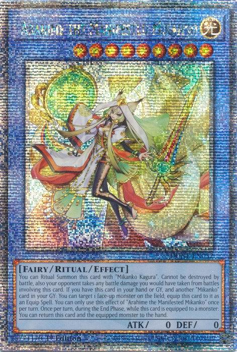 A Yu-Gi-Oh! trading card featuring "Arahime the Manifested Mikanko [DUNE-EN032] Quarter Century Secret Rare." The card depicts a female character in ornate clothing standing in front of a large, intricate staff. It's holographic with shimmering light effects, and includes text details about her fairy/ritual/effect attributes. This Quarter Century Secret Rare makes for an exceptional addition to any collection.