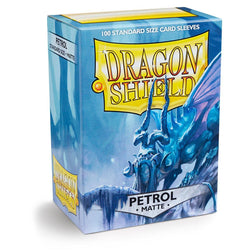 Arcane Tinmen's Dragon Shield: Standard 100ct Sleeves - Petrol (Matte) feature a fantasy dragon on a rocky perch in a blue and yellow box, ideal for protecting your card collection.