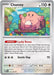 A Chansey (113/165) [Scarlet & Violet: 151] card from the Colorless category features Chansey, a pink, egg-shaped creature with a small smile, extending a hand forward while standing on a patch of grass with trees and a clouded sky in the background. The rare Pokémon card shows 110 HP with abilities "Lucky Bonus" and the move "Gentle Slap," dealing 70.