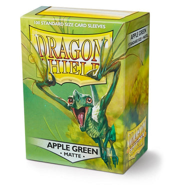 A box of Arcane Tinmen Dragon Shield: Standard 100ct Sleeves - Apple Green (Matte). The cover features a vibrant green dragon with wings outstretched against a matching green background. The text includes "Dragon Shield" in large letters, "100 Durable Standard Size Card Sleeves," and "Apple Green Standard Size Matte.