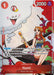 A rare card featuring Nami from the Straw Hat Crew. She is sitting on a black ship-like object next to a tree, holding a staff and smiling. The card includes various stats, abilities, and text describing her powers and role. In the background, there's a whimsical cloud with a face from the Bandai Nami (Gift Collection 2023) [One Piece Promotion Cards] series.