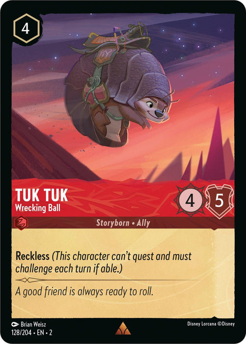 A Disney trading card called "Tuk Tuk - Wrecking Ball (128/204) [Rise of the Floodborn]." The card features an armored armadillo-like creature in midair against a sunset backdrop. The character's stats are 4 Attack and 5 Defense with the Reckless ability. Text below reads, "A good friend is always ready to roll." This card belongs to the Rise of the Floodborn series.