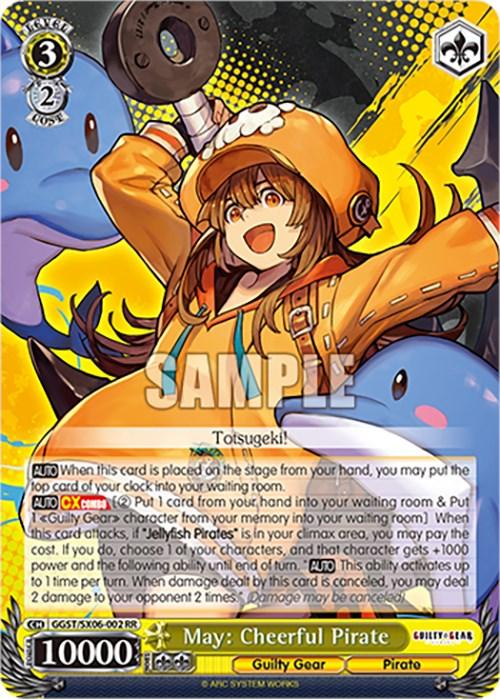 The image displays a May: Cheerful Pirate (GGST/SX06-002 RR) [Guilty Gear -Strive-] trading card from Bushiroad. It showcases May, a cheerful girl in a yellow raincoat and hat, wielding an enormous anchor amidst several blue sea creatures. The card text elaborates on her unique abilities.