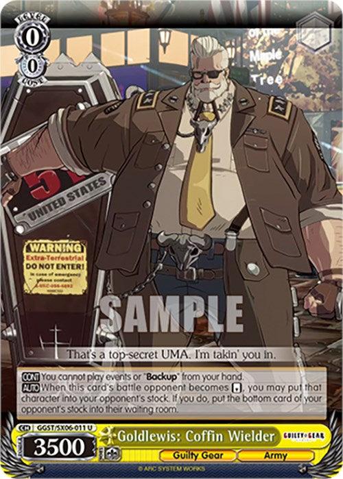 This Bushiroad trading card, Goldlewis: Coffin Wielder (GGST/SX06-011 U) [Guilty Gear -Strive-], showcases Goldlewis Dickinson from Guilty Gear. He is a large, bearded man with an eyepatch, dressed in a military-style outfit adorned with badges and a sheriff star. Carrying a coffin labeled "Area 51," the card includes various stats and game text.