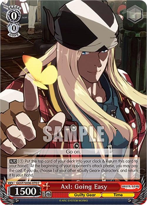 A Bushiroad Card featuring Axl: Going Easy (GGST/SX06-070 C) [Guilty Gear -Strive-]. Axl, with his long blonde hair, wears a bandana and a jacket. He points towards the viewer, a yellow butterfly on his finger. The card details include attack 1500 and text descriptions at the bottom. The background shows another character and a lively scene.