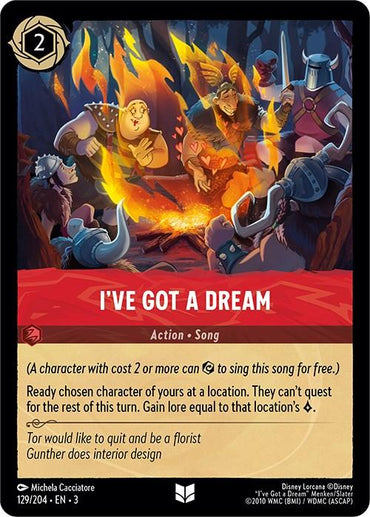 The image features a Disney fantasy card titled "I've Got a Dream" (129/204) from the "Into the Inklands" series, showcasing fairy tale characters gathered in a tavern, singing beneath warm, glowing lights. This card possesses action and song attributes, costs 2, and offers distinctive lore-driven abilities involving character interaction.