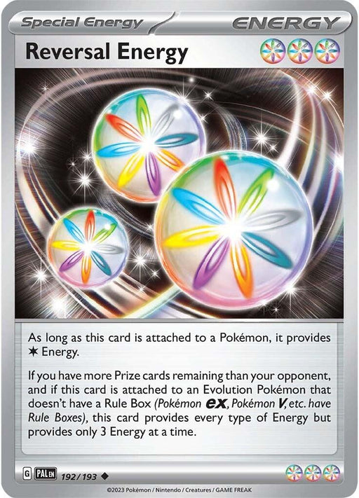 A Pokémon card titled "Reversal Energy (192/193) [Scarlet & Violet: Paldea Evolved]" with silver borders, part of the Paldea Evolved series. It features a vibrant, circular energy symbol composed of five colors - blue, red, green, yellow, and white. The card text describes its effect in the Pokémon TCG as Special Energy that provides three Energy if certain conditions are met.