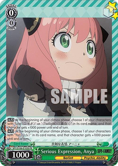 A promo trading card featuring "Serious Expression, Anya (SPY/S106-E103S PR) [SPY x FAMILY]" from Bushiroad. Anya, with pink hair and green eyes, is shown in a determined pose wearing her school uniform. The background has a green striped pattern. Various stats and game text are beneath the character image. "SAMPLE" is watermarked across the card.