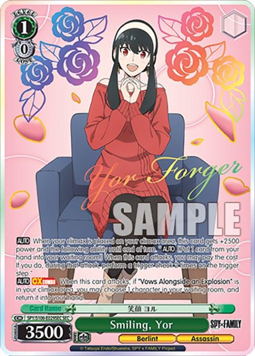 A Secret Rare character card features Smiling, Yor (SPY/S106-E029SEC SEC) [SPY x FAMILY] from the anime "SPY x FAMILY." She's seated on a chair, smiling brightly, and wearing a red dress. The background is adorned with colorful roses. The text includes her name, abilities, and card specs. A "SAMPLE" watermark spans across the card. This product is by Bushiroad.