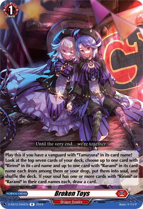 A brightly colored card from the trading card game Cardfight!! Vanguard. The card is titled "Broken Toys (D-SS12/094EN) [Triple Drive]" and depicts two gothic-dressed female characters in front of a vivid, circus-like background. The strategic instructions hint at a powerful Tamayura move within the Dragon Empire faction. This product is brought to you by Bushiroad.