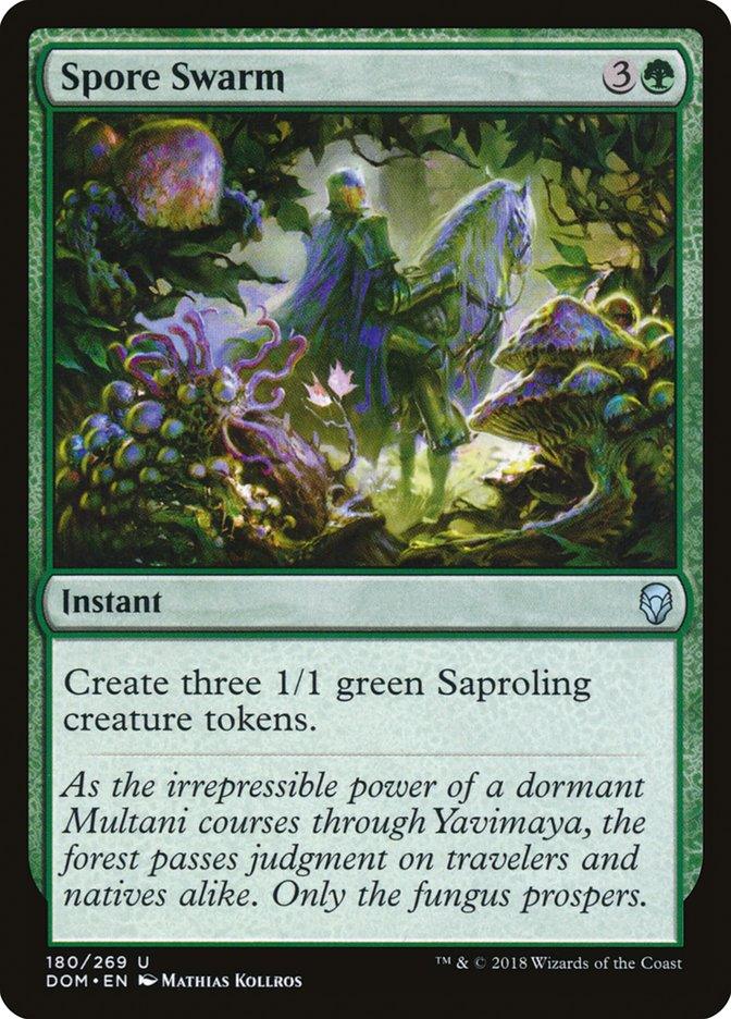 Magic: The Gathering's Spore Swarm [Dominaria] card features artwork of a mystical forest scene in Dominaria with a green, spectral figure casting an instant spell to summon three small, plant-like Saproling creatures. Text reads, 