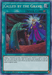 A Yu-Gi-Oh! Quick Play Spell card titled "Called by the Grave [MP19-EN043] Prismatic Secret Rare." The 2019 Gold Sarcophagus Tin features this Prismatic Secret Rare, showcasing artwork of a green, clawed hand emerging from the ground to reach a bearded older man in a purple robe. The card text describes banishing a monster from the opponent's graveyard and negating its effects.