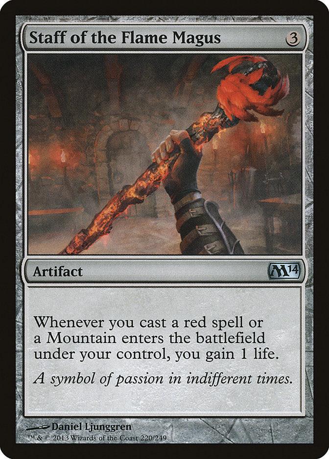 Magic: The Gathering's "Staff of the Flame Magus" [Magic 2014] features a hand gripping an intense fiery red artifact staff against a dim stone backdrop, granting life gain when casting red spells or playing Mountain cards.