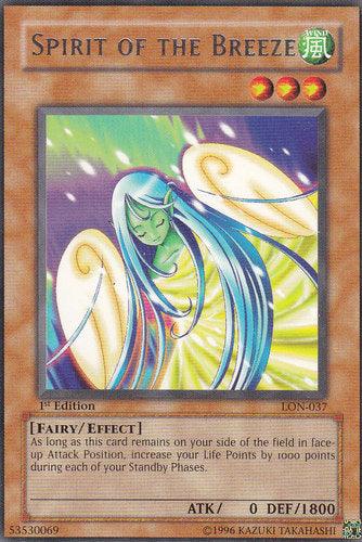 The Yu-Gi-Oh! card "Spirit of the Breeze [LON-037]" Rare, illustrated with a fairy-like figure with blue-green hair and glowing wings amidst a golden aura, is a 1st Edition Effect Monster card with ATK 0, DEF 1800. Its effect enhances life points.