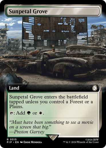 The image is a Magic: The Gathering card titled "Sunpetal Grove (Extended Art) [Fallout]." It depicts a desolate, post-apocalyptic drive-in theater with overgrown vegetation and abandoned vehicles. This rare land enters the battlefield tapped unless you control a Forest or Plains, and it can produce either green or white mana. "Must have been something to see a movie on a screen that big." —Preston Gar