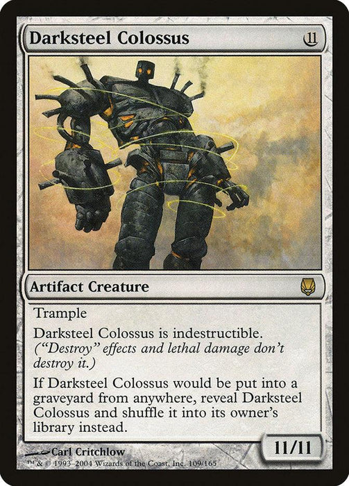 The image is of a rare "Magic: The Gathering" card named "Darksteel Colossus [Darksteel]." This artifact creature boasts an 11/11 power and toughness, with abilities like Trample and Indestructibility. Uniquely, it returns to its owner's library instead of the graveyard.