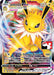 A Pokémon trading card featuring Jolteon VMAX (051/203) [Prize Pack Series One] from Pokémon. Jolteon, a yellow, spiky-furred creature with large ears and a white mane, boasts "HP 300." It wields "Max Thunder Rumble," dealing 100 damage. The colorful background swirls behind game-related details.