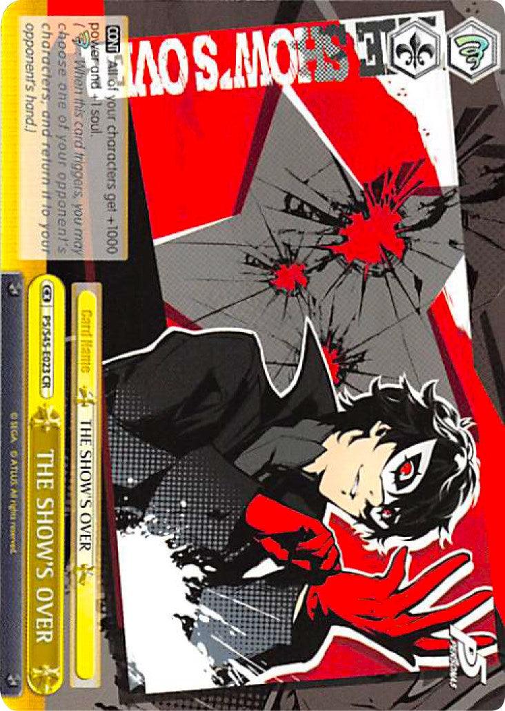 A tilted trading card from the Persona 5 series showcases a character in a dramatic pose. The character has black messy hair, a white mask with red accents, a black coat, and red gloves. As THE SHOW'S OVER (P5/S45-E023 CR) [Persona 5] by Bushiroad, it features 