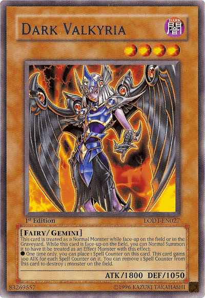 A Yu-Gi-Oh! trading card featuring "Dark Valkyria [LODT-EN027] Rare," a Gemini Monster. The card has a dark brown border with intricate designs. Dark Valkyria, a winged female warrior in dark blue and silver armor, holds a staff with a glowing purple orb. Her stats are ATK/1800 and DEF/1050. The card text and attributes are visible.