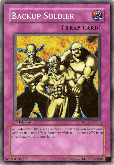 A Yu-Gi-Oh! trading card titled "Backup Soldier [5DS1-EN035] Common" from the 5D's Starter Deck, with a Normal Trap type and common rarity. It features an illustration of three muscular, bald men in fighting stances, one in the foreground holding a glowing object. The background is purple with description text below detailing the card's effect.