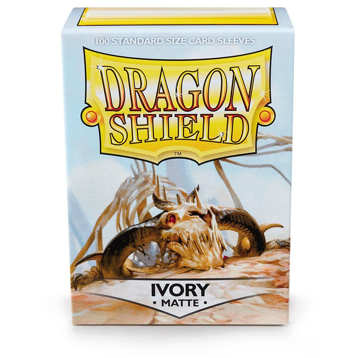 Image of an Arcane Tinmen brand box for Dragon Shield: Standard 100ct Sleeves - Ivory (Matte). The box features an illustration of a skull with large, curved horns set against a light blue backdrop. The text 