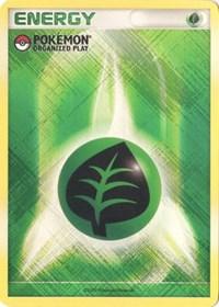 A Pokémon trading card titled "Grass Energy (2009 Unnumbered POP Promo) [League & Championship Cards]" with a distinct green, white, and yellow background. At the center is a circular icon featuring a dark green leaf on a black background, symbolizing Grass-type energy. The top left corner displays the Pokémon logo and the words "Organized Play: League & Championship Cards.